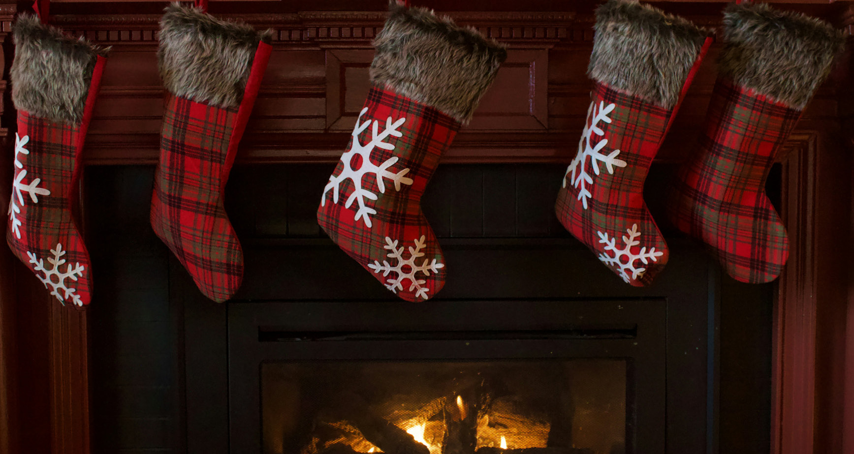 Hang festive stockings above your fireplace in your new home.