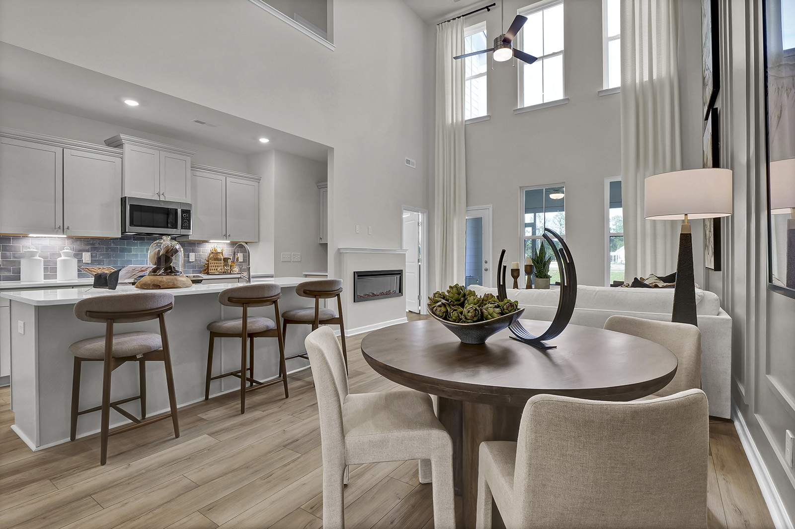 Townhome interior showing the kitchen, eat-in, and great room.