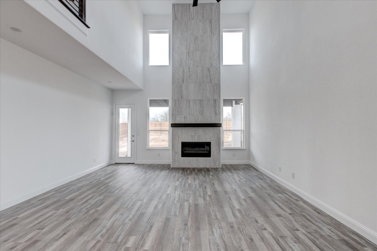 In the Springtown Build on Your Lot Project, Sandlin Homes was able to create a more dramatic and eye catching living space by moving the fireplace to be the center of attention.