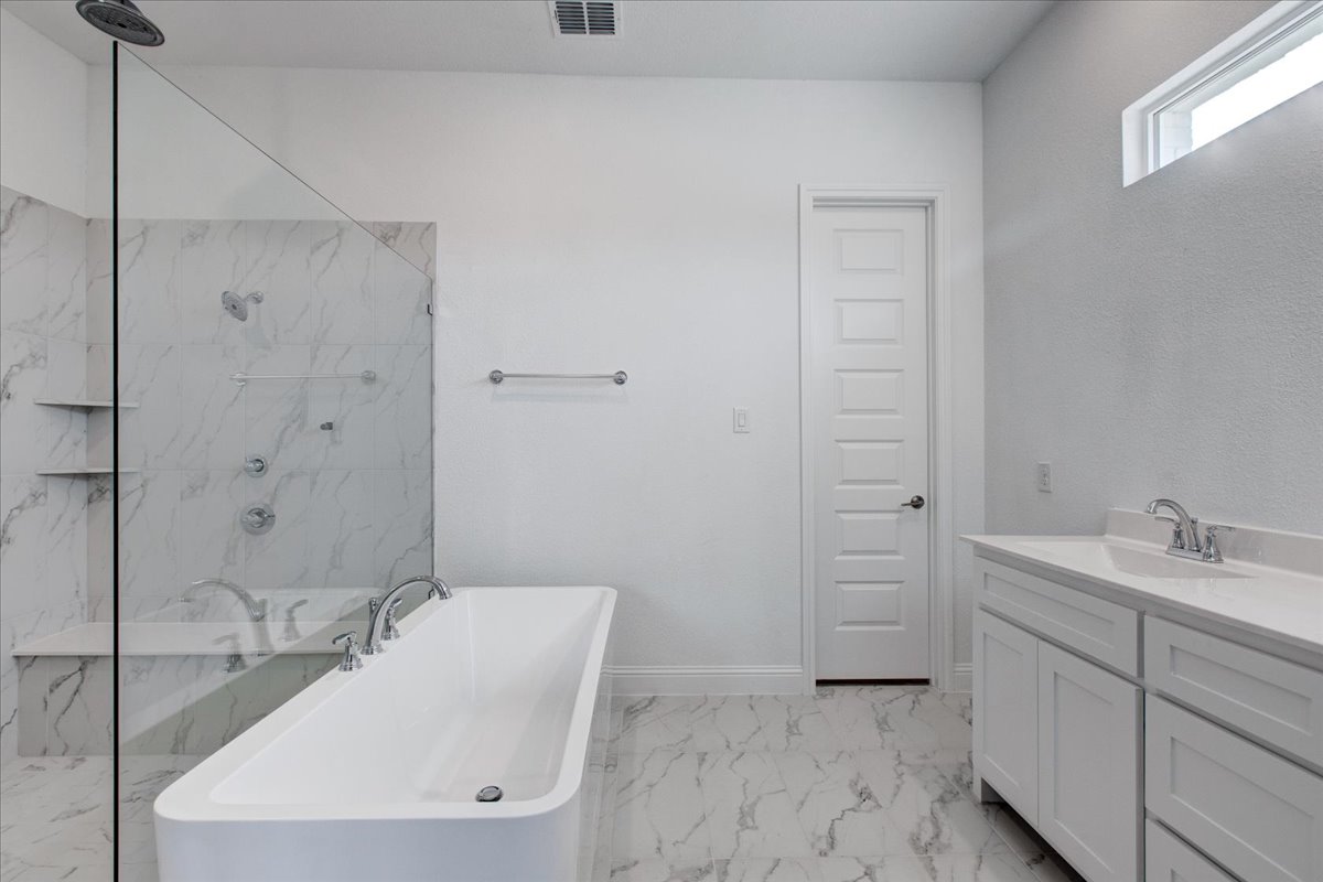 Spacious bathroom in the Springtown Build on Your Lot Project by Sandlin Homes.