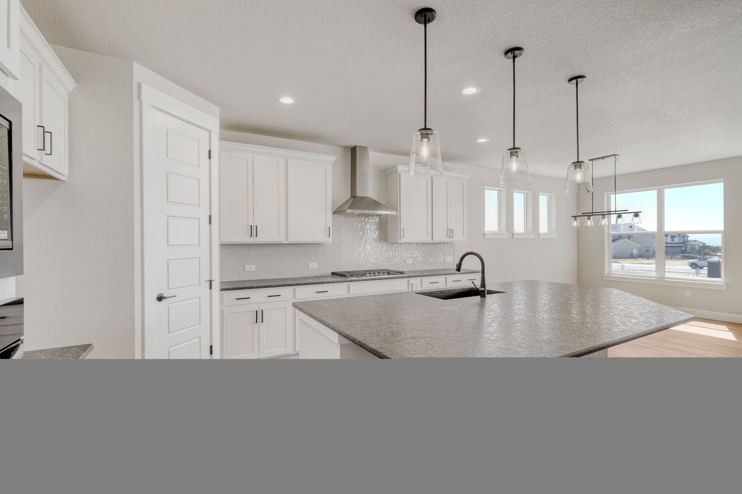 8702 Long Beach - Kitchen. 3,935sf New Home in Colorado Springs, CO