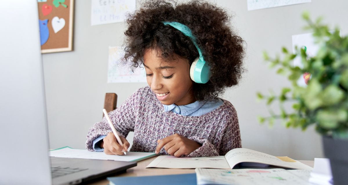 A child getting ready for the new school year in their McGuinn home.