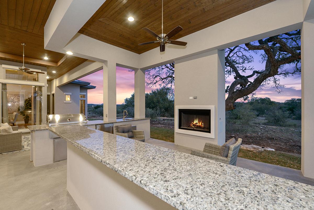 Luxury custom home outdoor living area overlooking Texas Hill Country