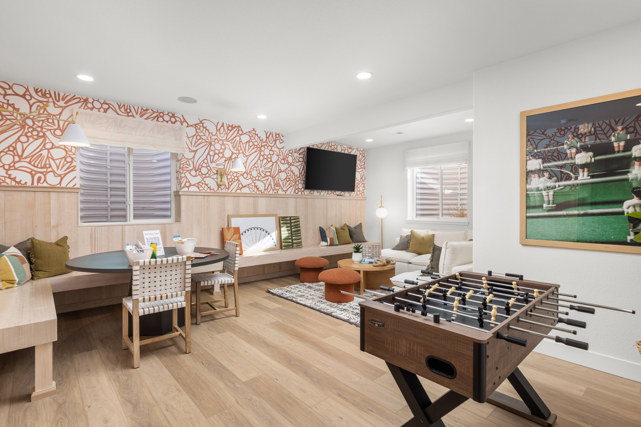 Bright and fun basement game room, complete with built-in bench seating