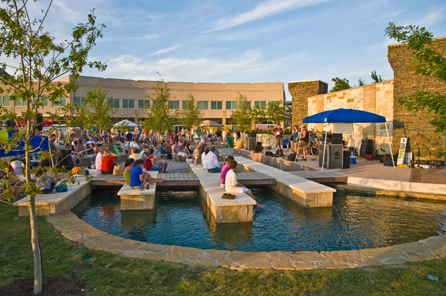 community enjoying a live concert in the park