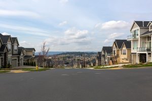 Looking Down a New Housing Development Street on a Hill - New Tradition Homes