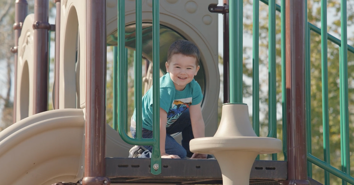 Child playing on the community playground.