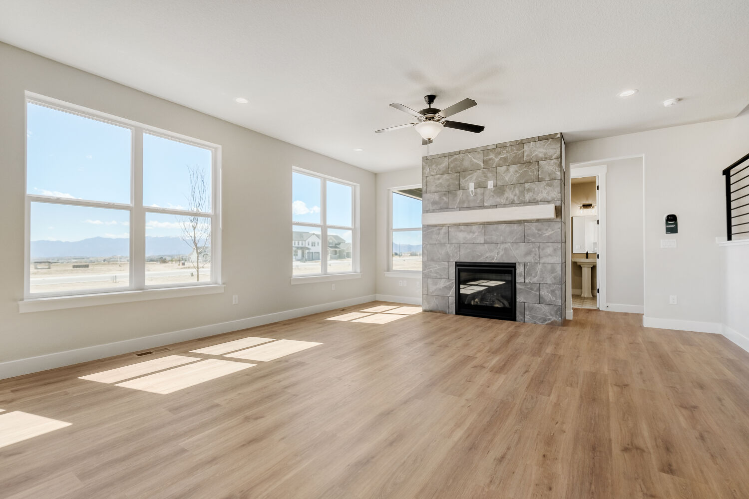 8702 Long Beach - Living Area. 5br New Home in Colorado Springs, CO