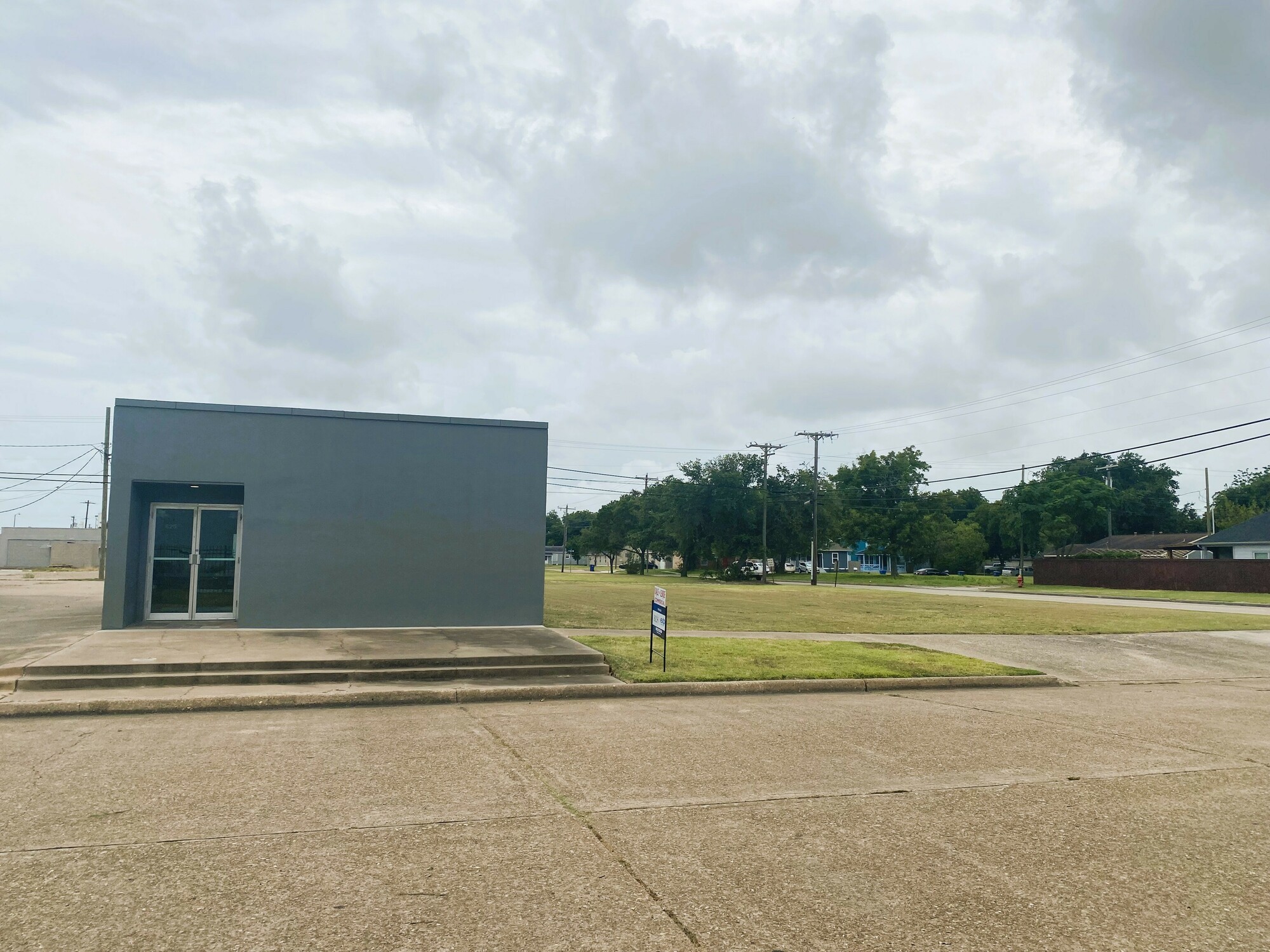 Perfect office with reception and fenced in yard with large open lot with curb cut!  