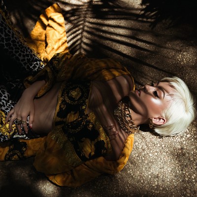 Agnez Mo Laying Down In  A Yellow Versace Outfit  B00A6023.jpg