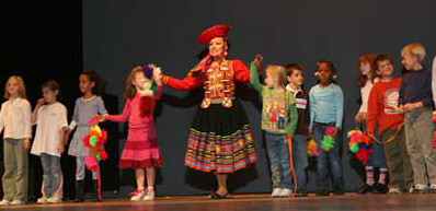 After performing a Peruvian dance, second graders from Kearns School take a bow with their instructor, the talented ballet dancer Edith Ortiz. After performing a Peruvian dance, second graders from Kearns School take a bow with their instructor, the talented ballet dancer Edith Ortiz.