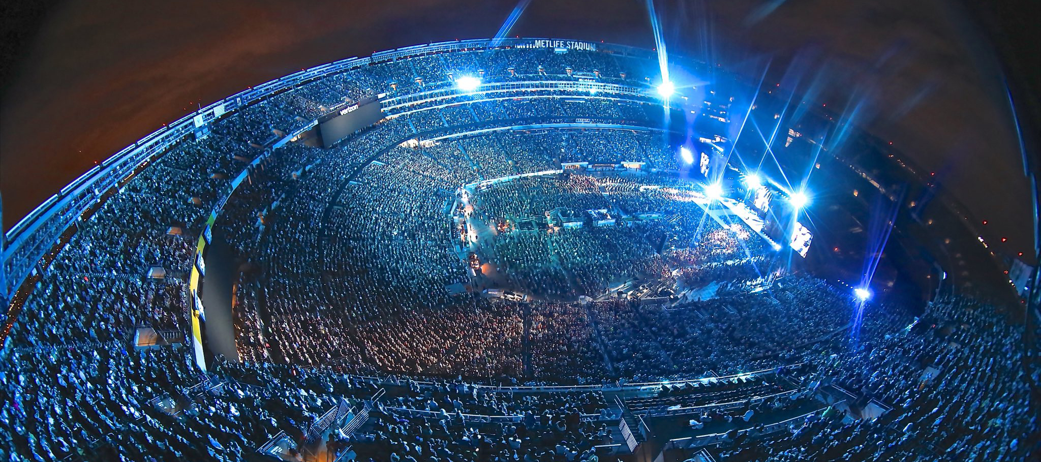 Kenny Rocks 58,642; Plays 23 Hits After Rain Delay 