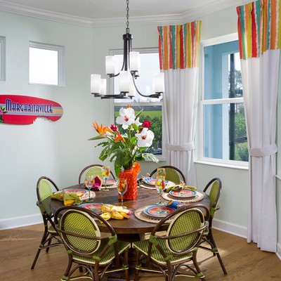 Large table with a vase of flowers and six chairs