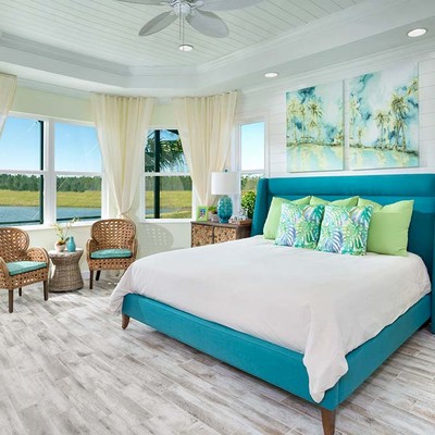 A room with two beds and two windows on one wall A room with two beds and two windows on one wall