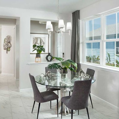 Room with a round glass table and 4 chairs Room with a round glass table and 4 chairs