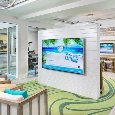 Large TV on the wall in front of the sofa