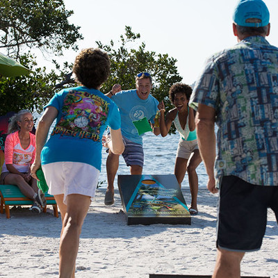 People having fun on the beach near the ocean