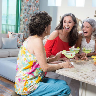 Three women are laughing