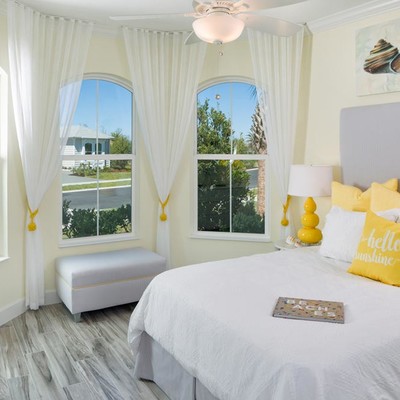 Bedroom with king size bed and two windows Bedroom with king size bed and two windows