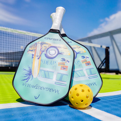 Two Margaritaville Pickleball paddles with a ball