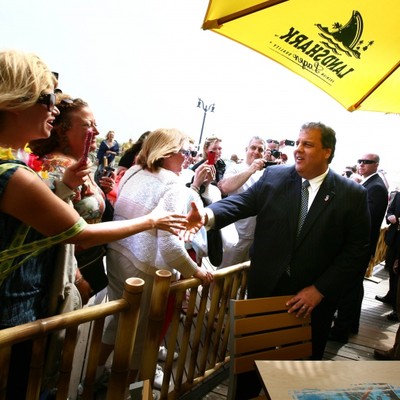 A man in a business suit greets a girl