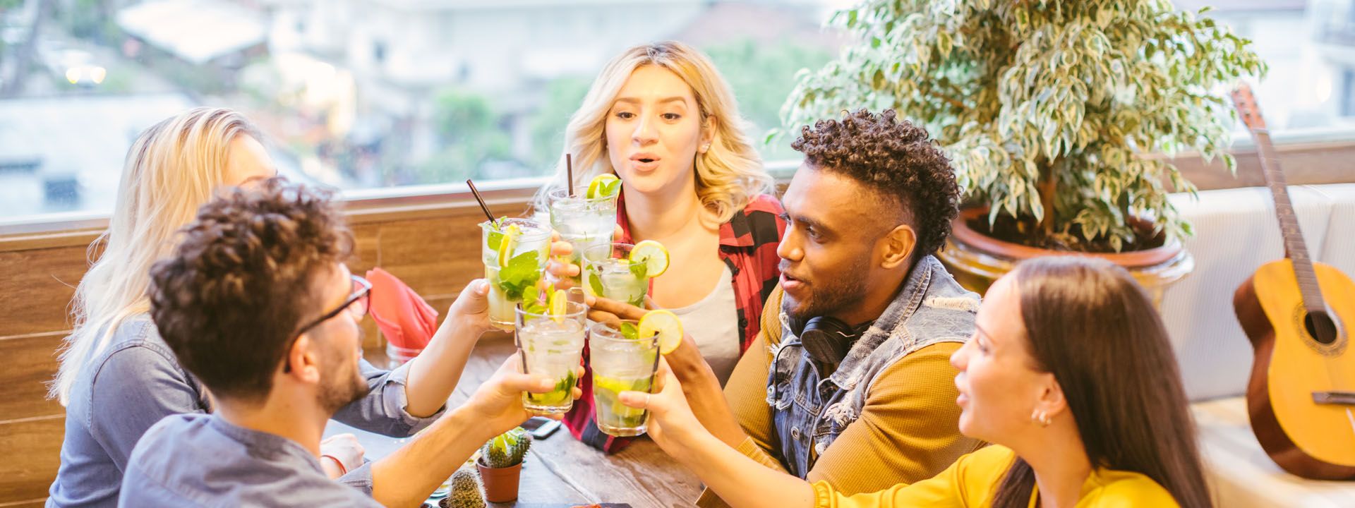 Group of friends doing cheers with some delicious cocktails Group of friends doing cheers with some delicious cocktails