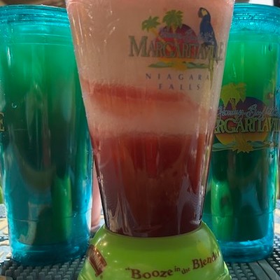 Photo of blended colorful frozen cocktail in a Margaritaville blender cup