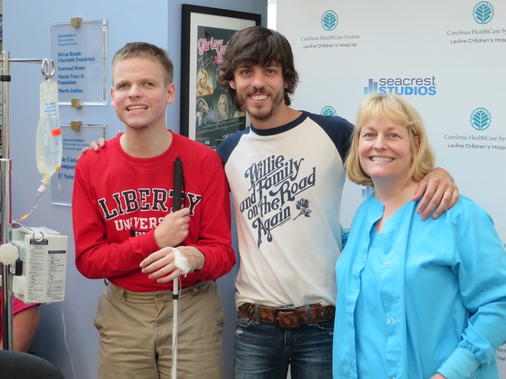 Chris Janson Signs A Duet With Patient At Seacrest Studios Charlotte