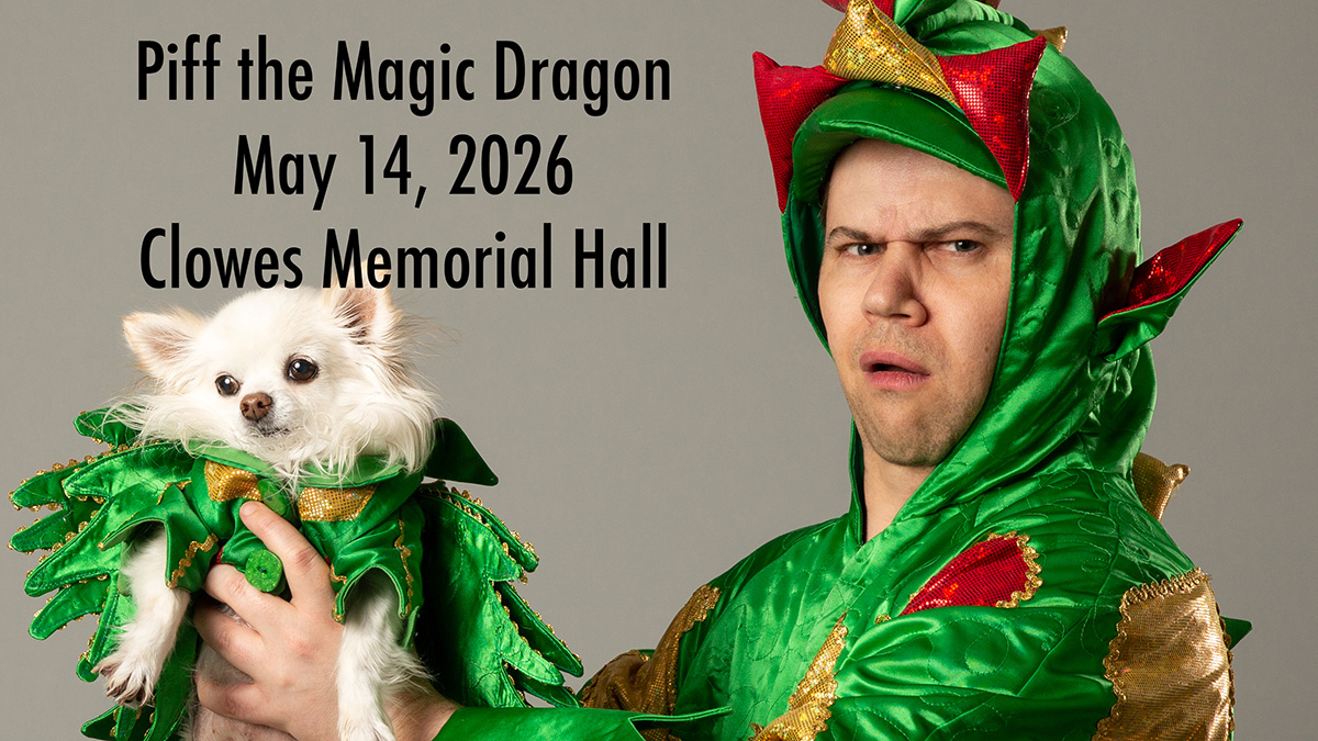 Man in a dragon costume holding a white dog in a dragon costume