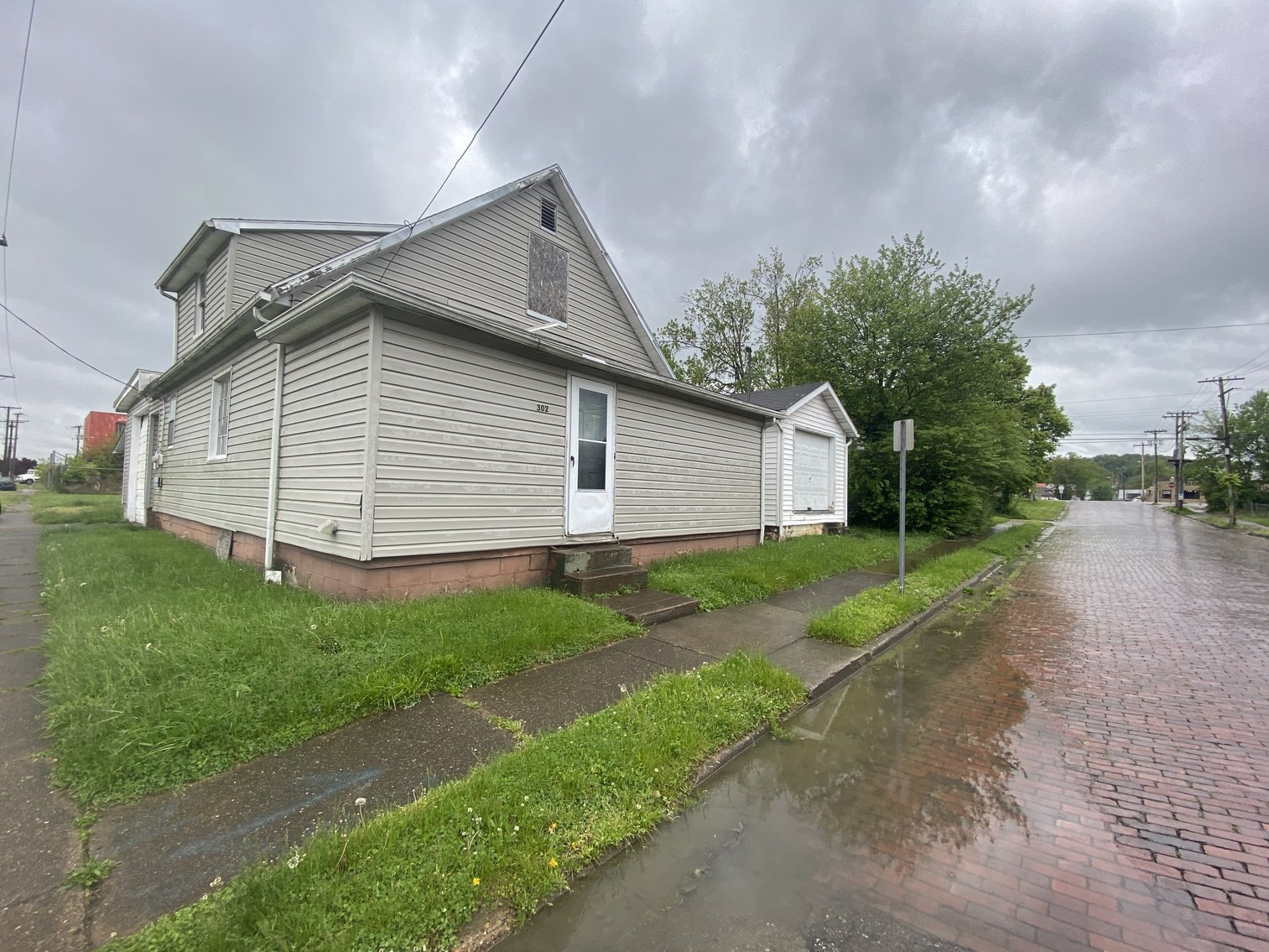Home on Corner Lot with Multiple Garages