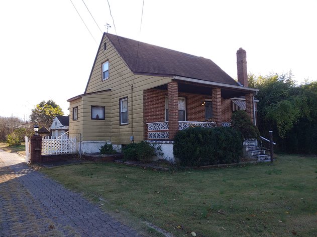 2 STORY CAPE COD HOME 3 BEDROOMS, 1 ½ BATHS,  DETACHED 3 VEHICLE GARAGE & CARPORT