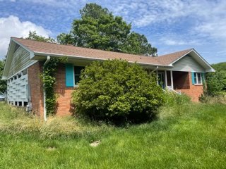 Image for Brick Ranch House w/ Basement and White Wooden House