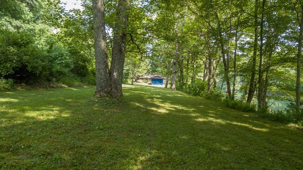 Image for SOLD $280,500 - Tygart Riverfront Camp on 4 Acres