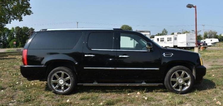 2007 Cadillac Escalade & 2001 Ford Focus