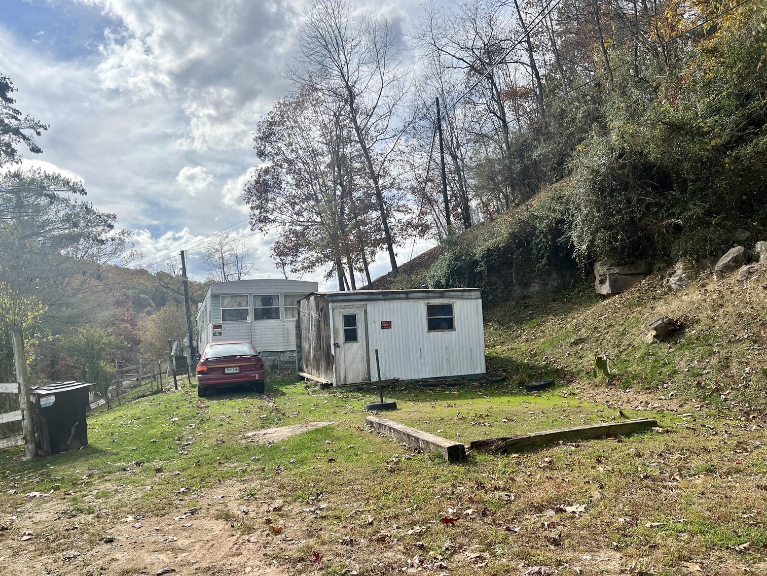 Image for SOLD $71,500 - Investment Opportunity – Three Homes & Mobile Home Park