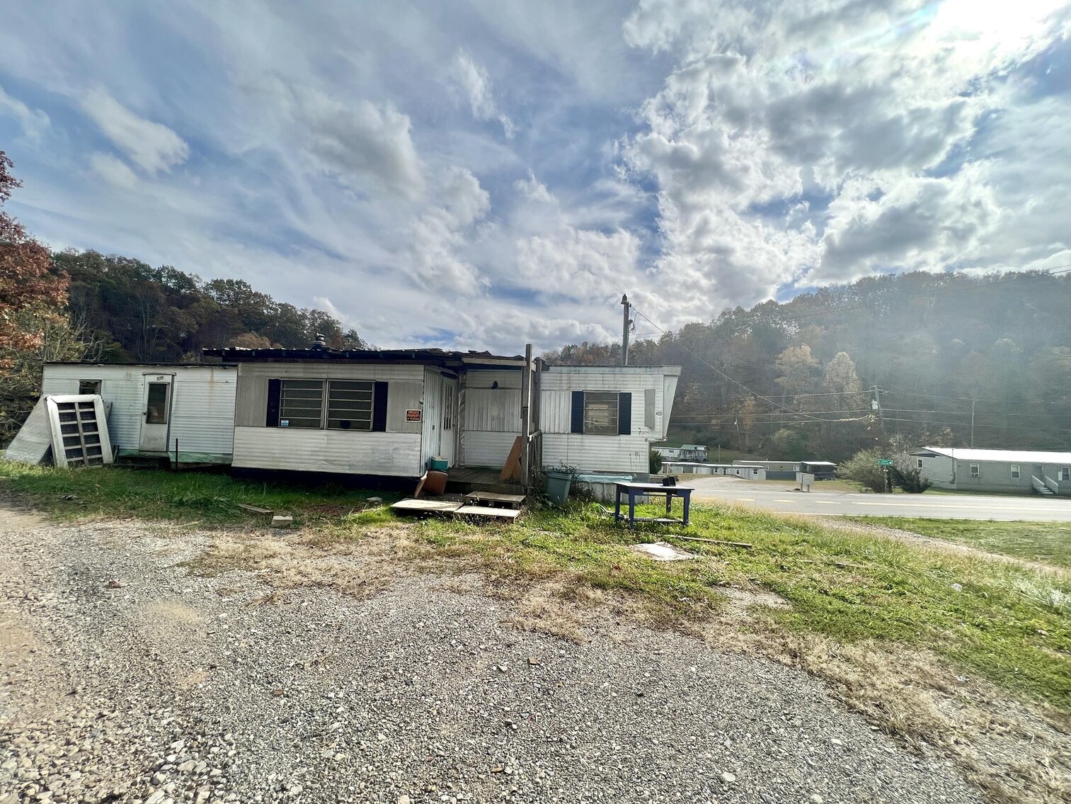 Image for SOLD $71,500 - Investment Opportunity – Three Homes & Mobile Home Park