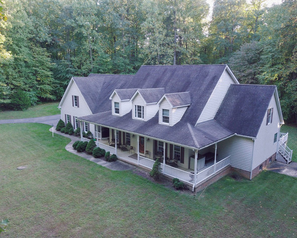 CUSTOM BUILT 8 BEDROOM, 5 ½ BATH HOME ON A 3.65+/- ACRE PRIVATE WOODED LOT
