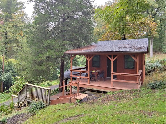 1 ROOM, 1 BA CABIN AND 2 ROOM LOG CABIN W/  30’ X 60’ FT BARN/RUN-IN W/ ELECTRIC ON 1.25+/- ACRES