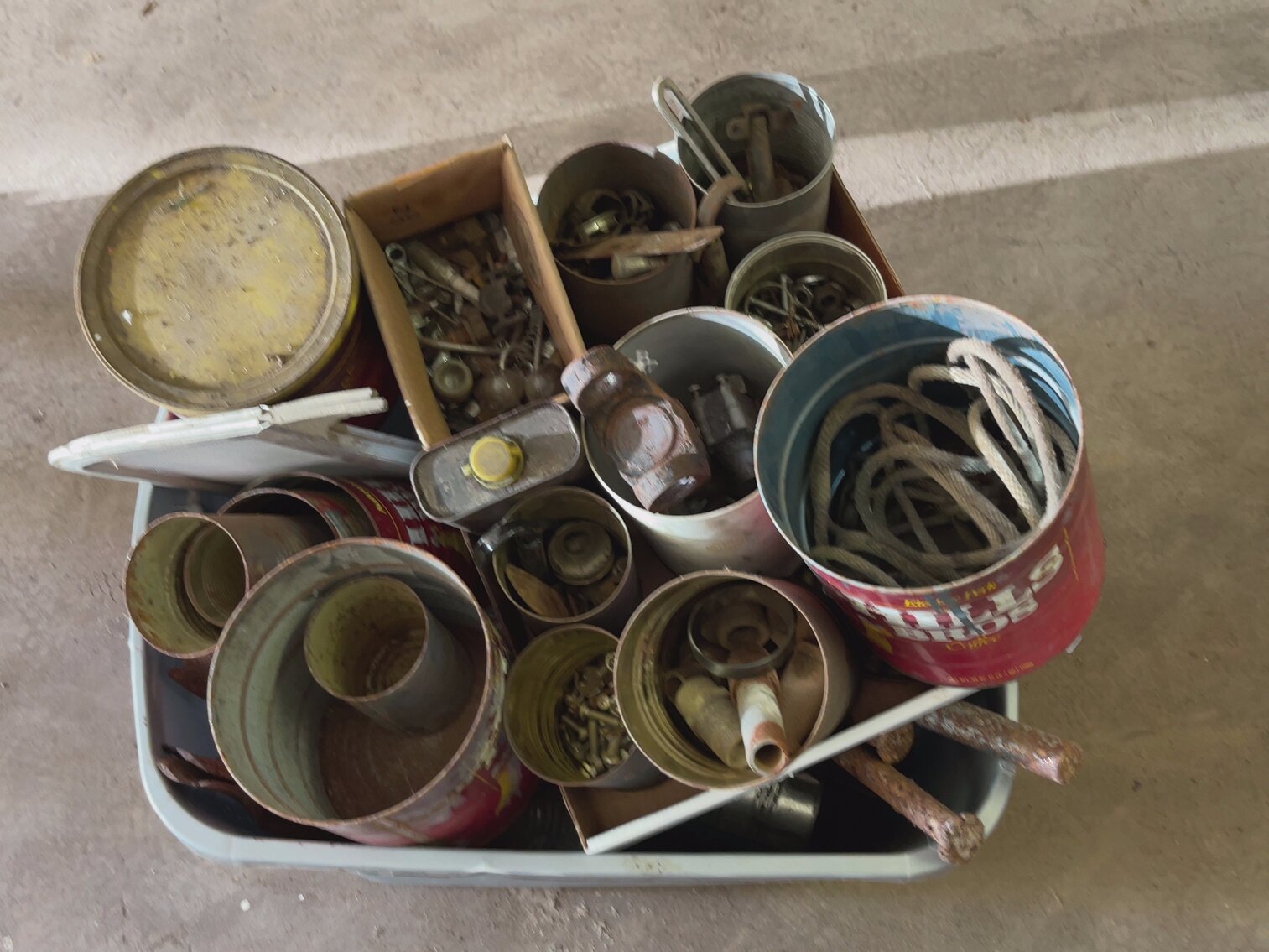 Tote of Cans and Hardware