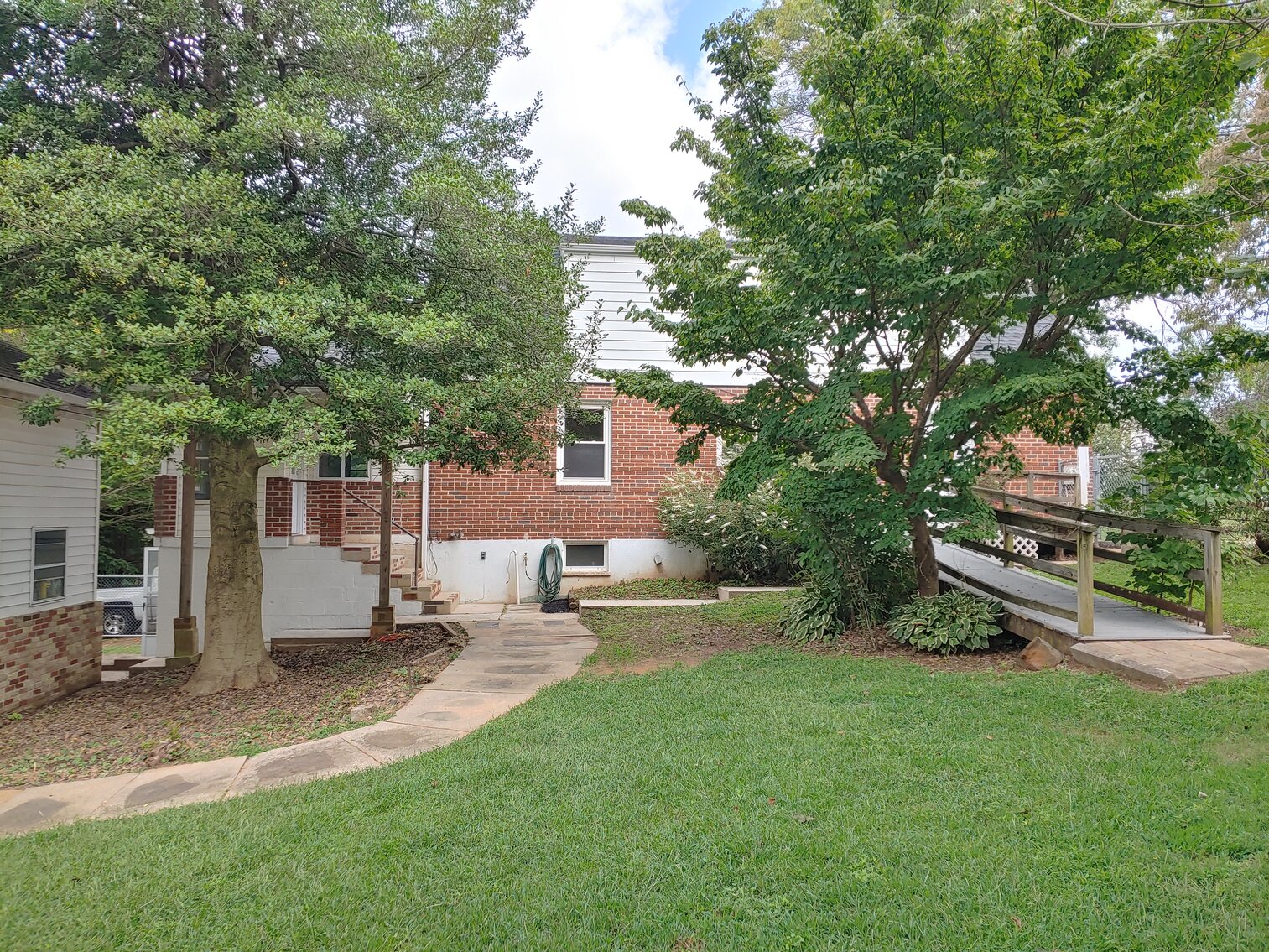 Image for 4 BR, 3 BA BRICK & VINYL SIDED HOME W/ ATT. GARAGE & DET. COMMERCIAL GARAGE W/ OVERSIZED ENTRANCE DOORS ON 0.48+/- ACRES