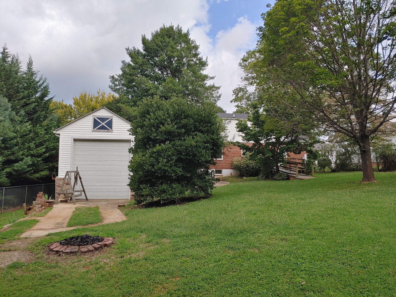 Image for 4 BR, 3 BA BRICK & VINYL SIDED HOME W/ ATT. GARAGE & DET. COMMERCIAL GARAGE W/ OVERSIZED ENTRANCE DOORS ON 0.48+/- ACRES