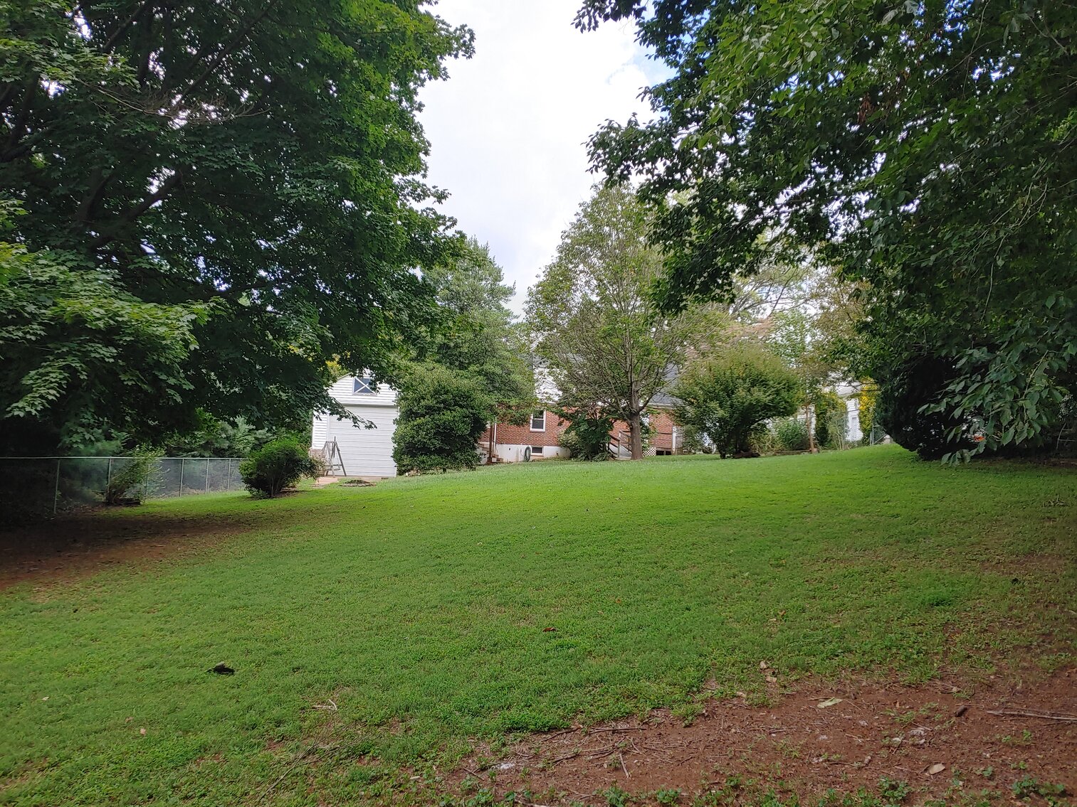 Image for 4 BR, 3 BA BRICK & VINYL SIDED HOME W/ ATT. GARAGE & DET. COMMERCIAL GARAGE W/ OVERSIZED ENTRANCE DOORS ON 0.48+/- ACRES