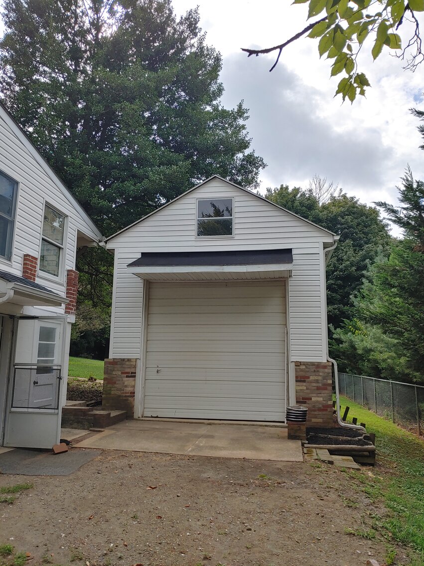 Image for 4 BR, 3 BA BRICK & VINYL SIDED HOME W/ ATT. GARAGE & DET. COMMERCIAL GARAGE W/ OVERSIZED ENTRANCE DOORS ON 0.48+/- ACRES