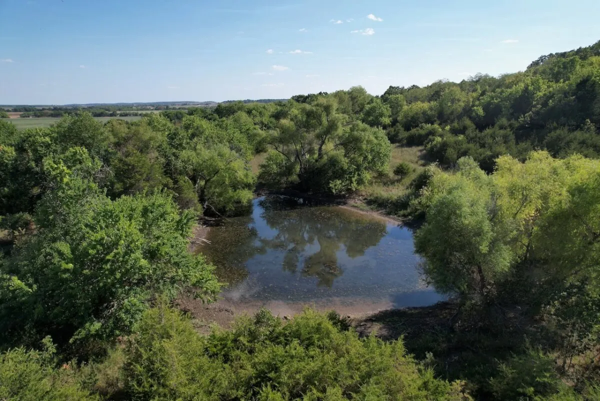 34.5 Acres Montgomery County, Kansas Land For Sale – Pond, Big Hills, Heavy Timber, Oil Income photo 3