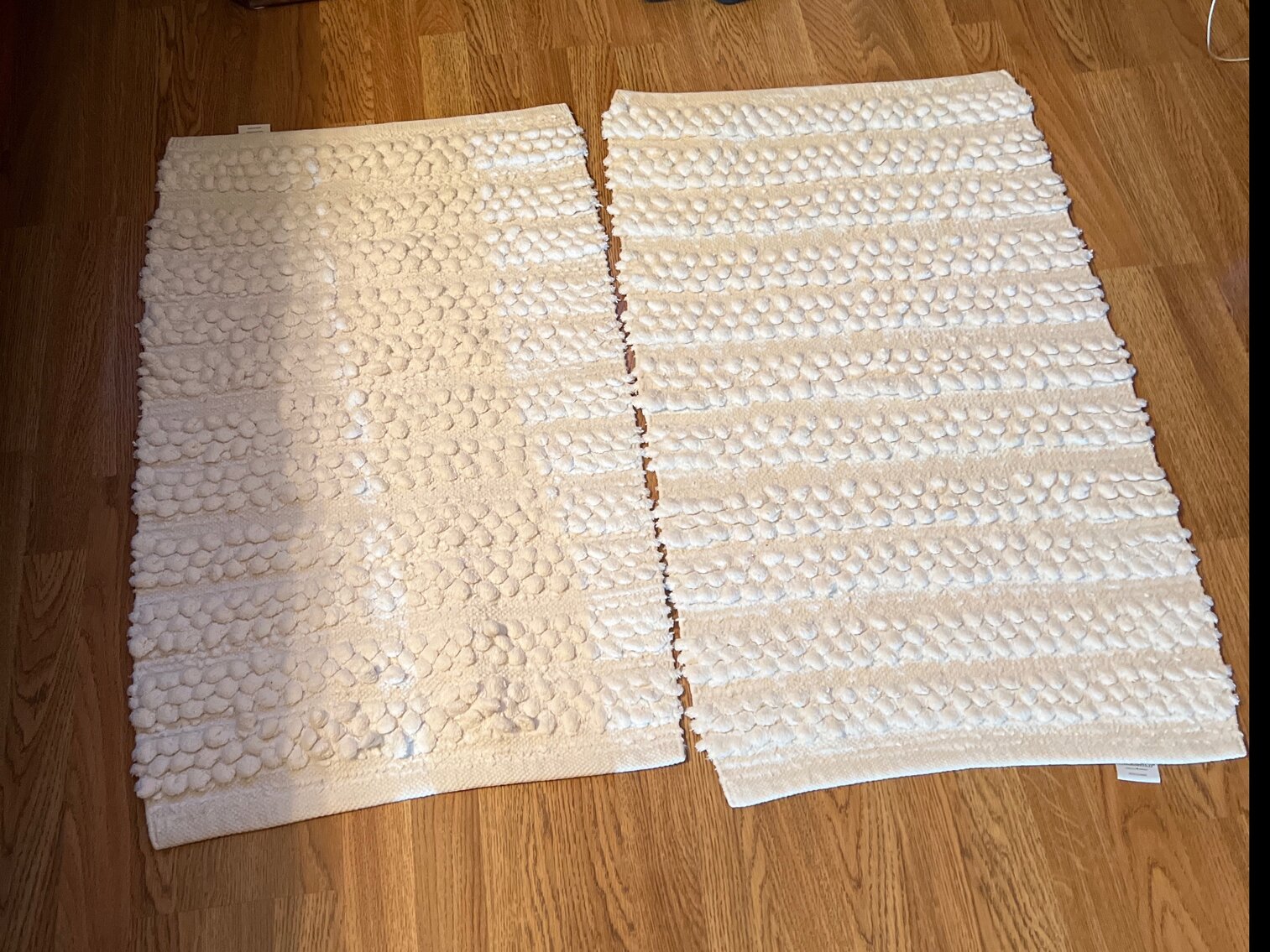 Two white rugs