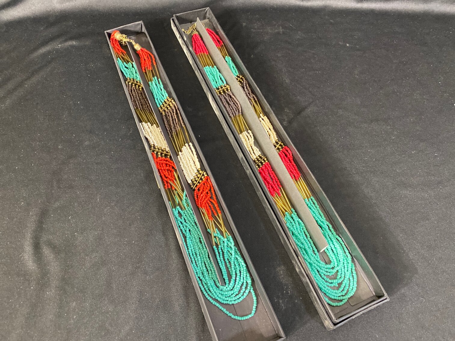 (2) Turquoise and Coral Colored Braded Necklaces