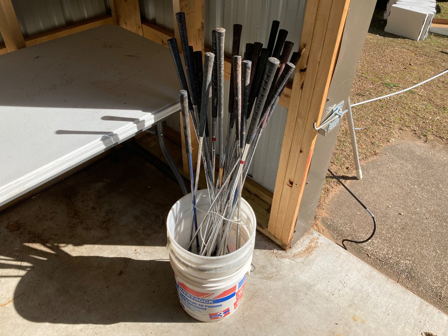 Pail of Golf Clubs