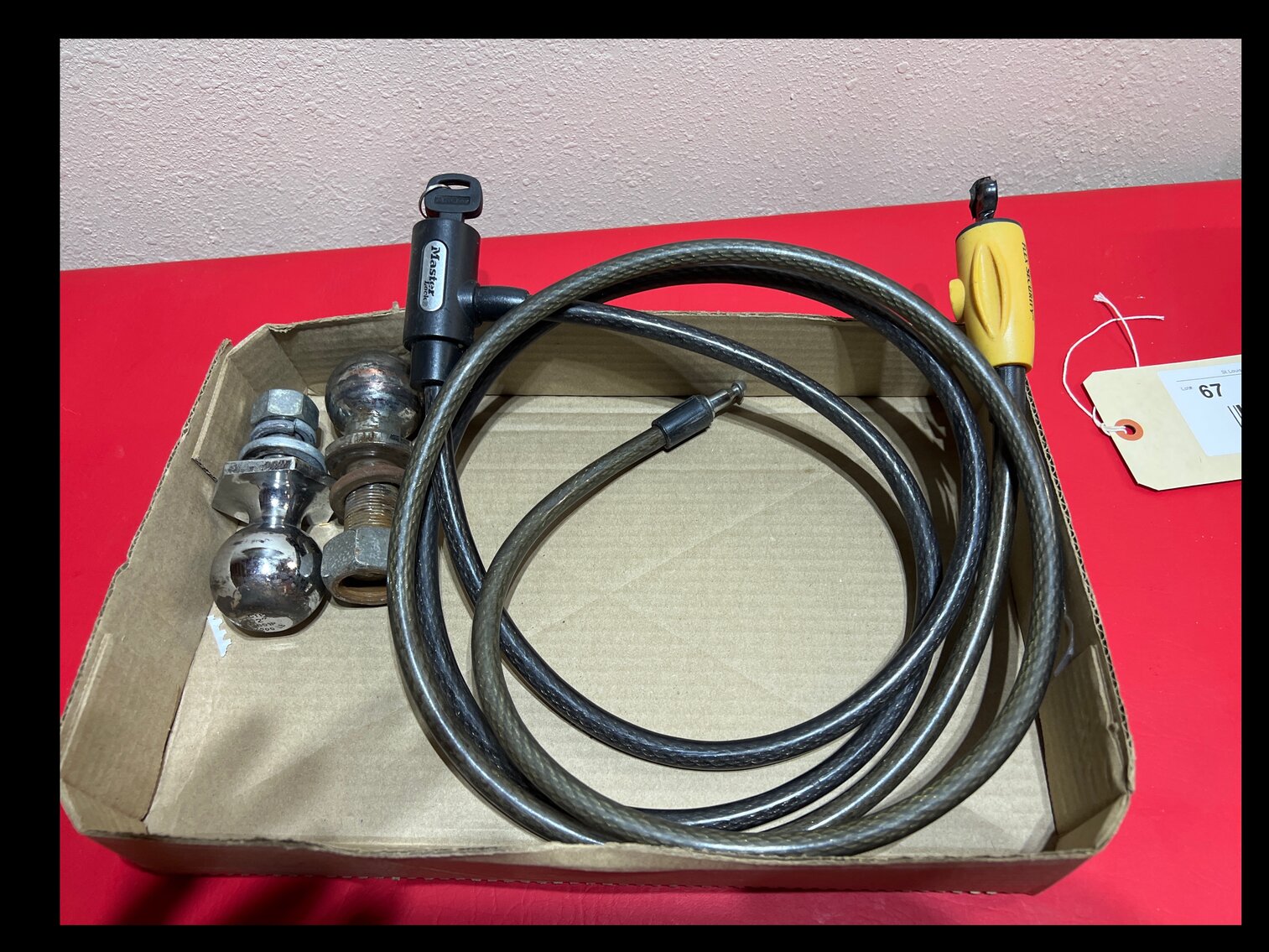 Bicycle cable locks with keys, trailer balls