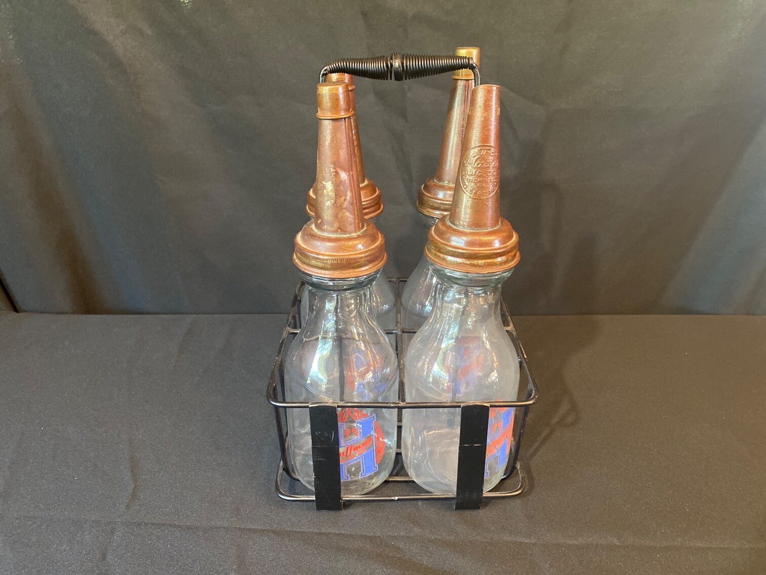 (4) HUFFMAN OIL BOTTLES WITH RACK