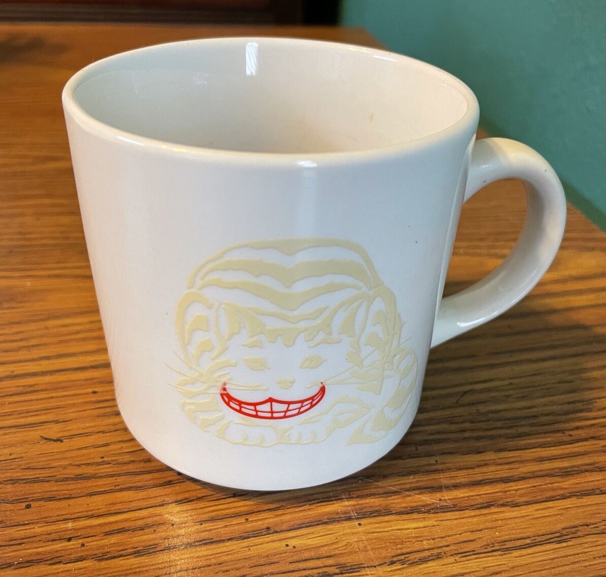 Disappearing Cheshire Cat Mug